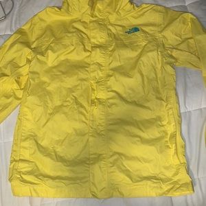 Yellow north face raincoat. Size XL in girls.